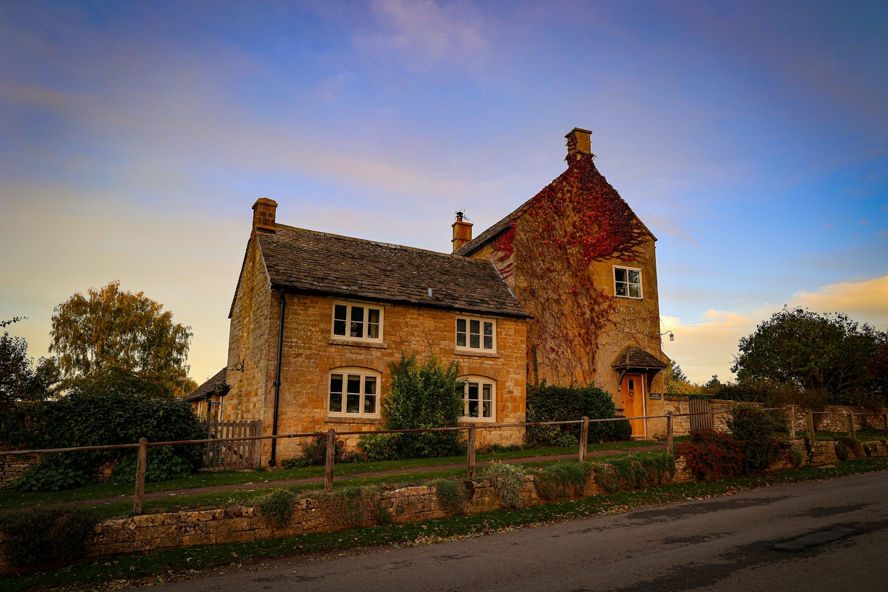 Large brick house with a fence