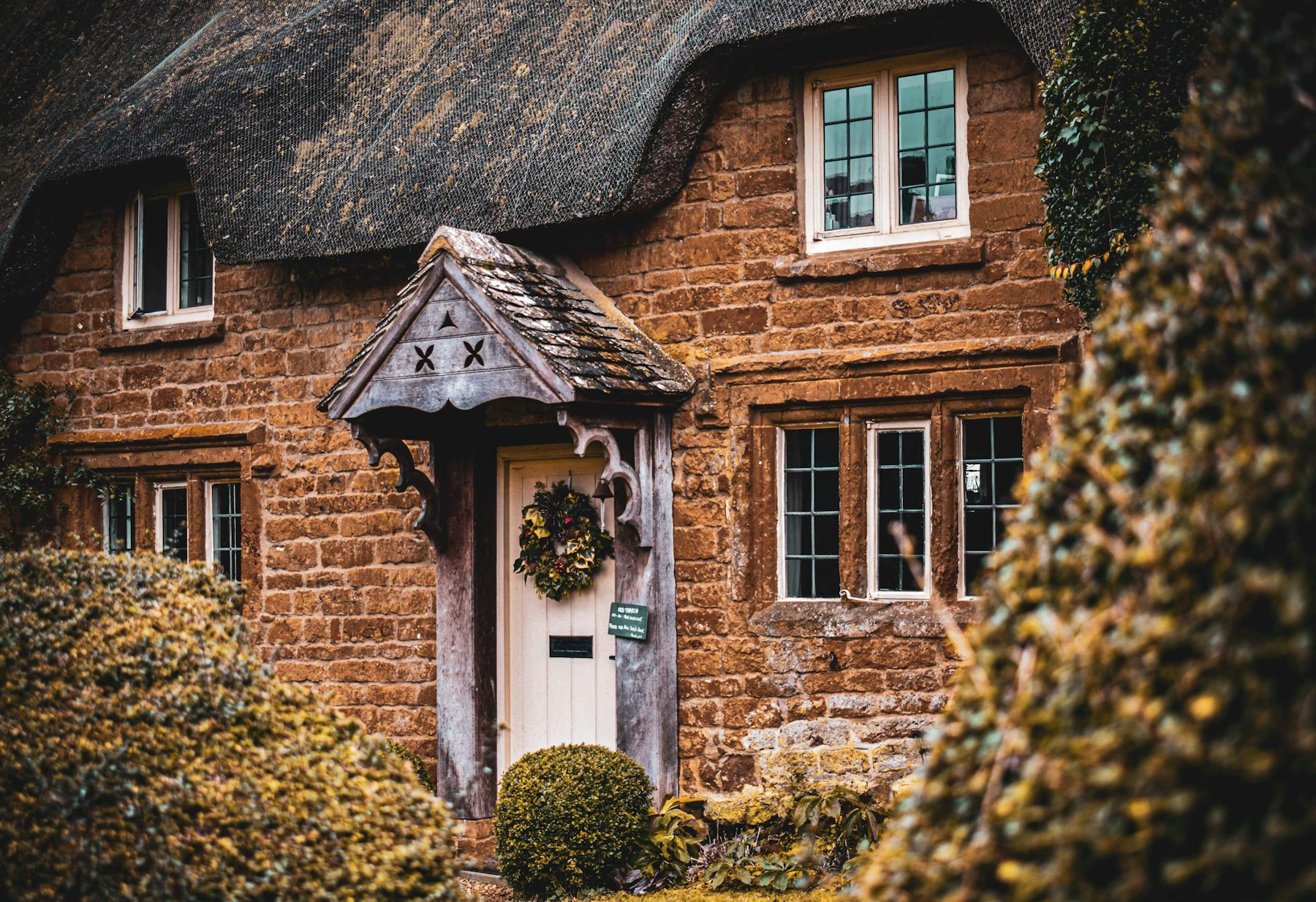 Cotswold cottage with a white wooden door
